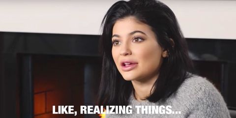 This is a still from Kylie Jenner's 2016 New Year Resolutions video. It shows her head and shoulders with the quote "like, realizing things..."